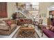 Spacious living room with staircase, stylish furniture, and neutral colors at 4855 Regency Sw Trce, Atlanta, GA 30331