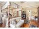 Luxurious main bedroom with a four-poster bed, fireplace, and elegant decor at 4855 Regency Sw Trce, Atlanta, GA 30331