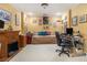 Home office with a decorative fireplace, built-in desk, and comfortable daybed at 4855 Regency Sw Trce, Atlanta, GA 30331