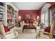 Inviting sitting room with bookshelves, soft lighting, and comfortable seating at 4855 Regency Sw Trce, Atlanta, GA 30331