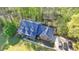 An aerial shot shows a well-maintained house with a blue roof, along with three parked cars at 5800 S Richland Creek Rd, Buford, GA 30518