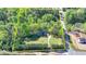 Aerial view highlighting the property lines and showcasing the home, driveway, and surrounding greenery at 5800 S Richland Creek Rd, Buford, GA 30518