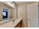 Bathroom with long countertops, oak cabinets, and large mirrors over the sinks at 5800 S Richland Creek Rd, Buford, GA 30518