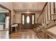 Grand foyer with hardwood floors, staircase, and decorative rug at 5800 S Richland Creek Rd, Buford, GA 30518