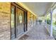 Charming front porch with brick flooring and covered entrance at 5800 S Richland Creek Rd, Buford, GA 30518
