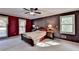 A bedroom features carpeted floors, two bedside tables, and windows at 5800 S Richland Creek Rd, Buford, GA 30518