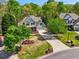 Landscaped front lawn complements a two-story house in an aerial shot at 6565 Scottsfield Trce, Cumming, GA 30028