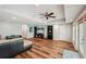 Finished basement with hardwood floors, recessed lights, and door leading to the exterior at 6565 Scottsfield Trce, Cumming, GA 30028