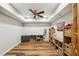 Finished basement with wood-look floors, recessed lights, ceiling fan, and bonus/flex space at 6565 Scottsfield Trce, Cumming, GA 30028