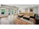 Finished basement features recessed lighting, wood flooring, and access to the backyard at 6565 Scottsfield Trce, Cumming, GA 30028