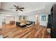 Finished basement living area with recessed lighting, wood floors, and comfortable seating at 6565 Scottsfield Trce, Cumming, GA 30028