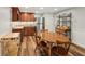 Basement kitchenette with wood cabinets, stainless steel fridge, and dining table at 6565 Scottsfield Trce, Cumming, GA 30028