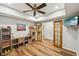 Finished basement with wood-look floors, recessed lights, ceiling fan, and bonus/flex space at 6565 Scottsfield Trce, Cumming, GA 30028