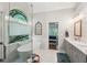 Bright bathroom with a soaking tub, shower, double vanity, and bedroom visible through doorway at 6565 Scottsfield Trce, Cumming, GA 30028