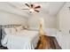 Bedroom featuring neutral decor, wood floors and ceiling fan at 6565 Scottsfield Trce, Cumming, GA 30028