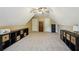 Spacious bonus room featuring neutral carpet, multiple storage areas and natural light at 6565 Scottsfield Trce, Cumming, GA 30028