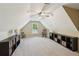 Spacious bonus room featuring neutral carpet, ceiling fan, and natural light at 6565 Scottsfield Trce, Cumming, GA 30028