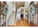 Grand foyer with hardwood floors and a staircase, featuring a view of the living room and dining area at 6565 Scottsfield Trce, Cumming, GA 30028