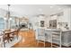 Well-lit open kitchen and breakfast nook, open to the living room with a stone fireplace at 6565 Scottsfield Trce, Cumming, GA 30028