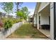 Backyard with retaining wall and landscaping, plus a covered patio at 763 Arrendale Dr, Marietta, GA 30064