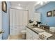 Bathroom with a vanity, framed mirror, framed art, and shower with white curtain at 763 Arrendale Dr, Marietta, GA 30064