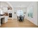 Eat-in kitchen features a black breakfast table, plenty of natural light, and hardwood floors at 763 Arrendale Dr, Marietta, GA 30064