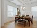 Traditional dining room with coffered ceiling, natural light, hardwood floors, and seating for six at 763 Arrendale Dr, Marietta, GA 30064