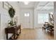 Bright foyer with hardwood floors, white walls, decorative accents and an adjacent dining area to the right at 763 Arrendale Dr, Marietta, GA 30064