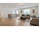 Bright living room with hardwood floors, neutral colors, and a comfortable seating area at 763 Arrendale Dr, Marietta, GA 30064