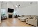 Bright living room featuring vaulted ceilings, hardwood floors, a fireplace, and a neutral color palette at 763 Arrendale Dr, Marietta, GA 30064