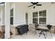 Covered patio featuring a fan, dining table with chairs, and a grill at 763 Arrendale Dr, Marietta, GA 30064