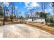 Charming home with a spacious backyard, a stone retaining wall and an area perfect for entertaining at 932 Mount Airy Sw Dr, Atlanta, GA 30311