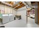 Unfinished basement area with washer, dryer, and work space, offering functionality and storage at 932 Mount Airy Sw Dr, Atlanta, GA 30311