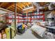 Basement storage area with bright red shelving, lots of boxes, and space for additional storage at 932 Mount Airy Sw Dr, Atlanta, GA 30311