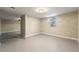 Open basement area with a window, showing an adaptable space ready for personalization at 932 Mount Airy Sw Dr, Atlanta, GA 30311
