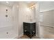 Modern bathroom featuring subway tile shower, updated vanity with two-drawer storage, and brushed nickel fixtures at 932 Mount Airy Sw Dr, Atlanta, GA 30311