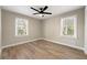 This bright and airy bedroom features luxury vinyl flooring, fresh neutral paint and plenty of natural light at 932 Mount Airy Sw Dr, Atlanta, GA 30311