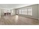 A formal dining area with a chandelier, light-filled windows, and wood flooring is perfect for everyday meals at 932 Mount Airy Sw Dr, Atlanta, GA 30311