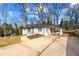 Picture of a freshly painted single-story home with a concrete driveway and attached carport at 932 Mount Airy Sw Dr, Atlanta, GA 30311