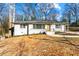 Charming, freshly painted single-story home with a welcoming front yard and minimalist landscaping at 932 Mount Airy Sw Dr, Atlanta, GA 30311