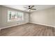 Well-lit living room with a ceiling fan, wood-look flooring, and white trim offers an inviting space at 932 Mount Airy Sw Dr, Atlanta, GA 30311