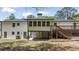 Backyard featuring an elevated deck with stairs and a large yard at 2327 Doreen Ne Ct, Atlanta, GA 30345