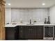 Finished basement bar with modern lighting and sleek cabinetry at 2327 Doreen Ne Ct, Atlanta, GA 30345