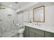 Modern bathroom featuring stylish tile, glass shower, and elegant vanity with gold fixtures at 2327 Doreen Ne Ct, Atlanta, GA 30345