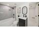 Modern bathroom features a bathtub, stylish tiles, contemporary vanity, and black accents at 2327 Doreen Ne Ct, Atlanta, GA 30345