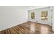 Bright bedroom with hardwood floors, white walls, and two windows providing natural light at 2327 Doreen Ne Ct, Atlanta, GA 30345