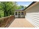 Wooden deck with a view of the surrounding trees and sky at 2327 Doreen Ne Ct, Atlanta, GA 30345