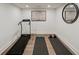 Home gym with a treadmill, yoga mats, and free weights at 2327 Doreen Ne Ct, Atlanta, GA 30345