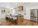 Gourmet kitchen with large island, stainless steel appliances, custom cabinets, and breakfast bar with seating at 2327 Doreen Ne Ct, Atlanta, GA 30345