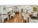 Open concept living and dining area with hardwood floors, stainless steel appliances, and modern furnishings at 2327 Doreen Ne Ct, Atlanta, GA 30345